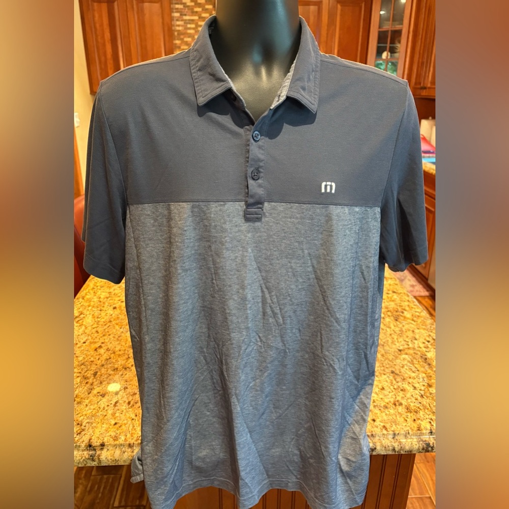 Travis Mathew men’s‎ golf polo. Sharp Two-Tone Navy/grey with logos front/back.
